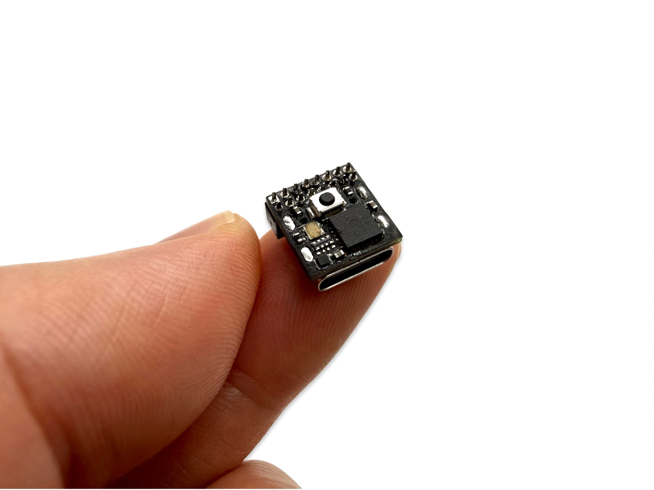 pinch Dev Board held between fingers